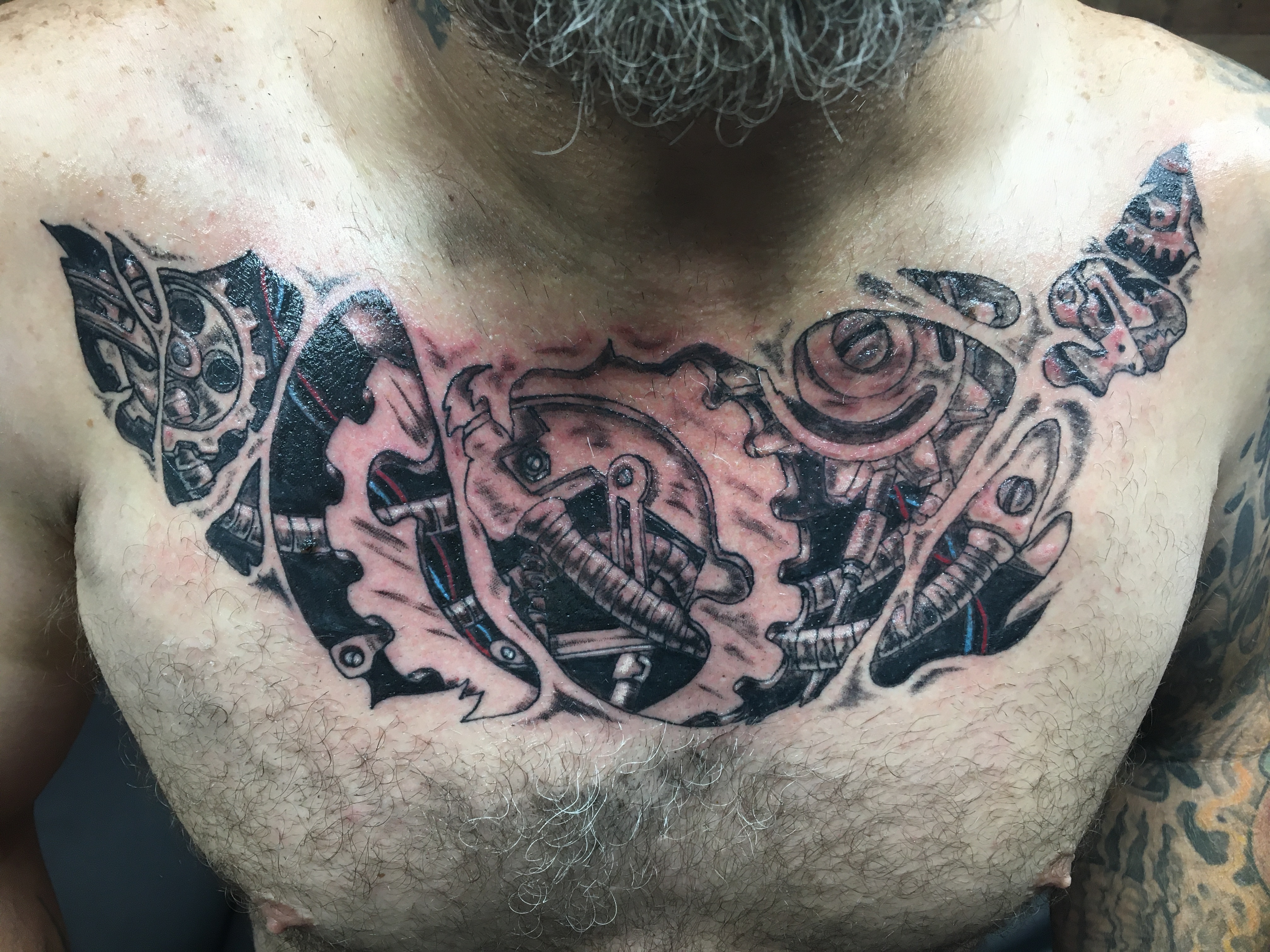 biomechanical chest tattoo