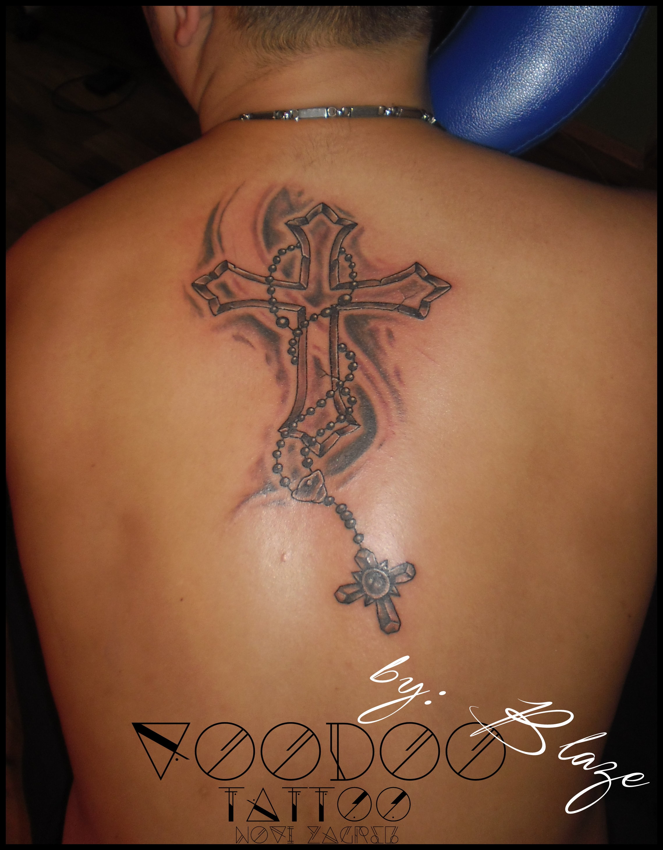 Black Cross Tattoo On Back